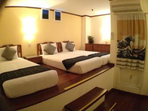
A bed or beds in a room at Perak Hotel (SG Clean, Staycation Approved)

