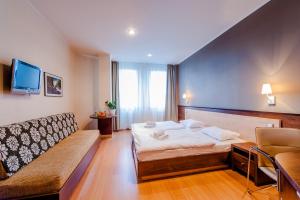 Postel nebo postele na pokoji v ubytování Congress Hotel Centrum + 37 fotografií