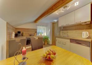 a kitchen with a table with a candle on it at Panoramablick in Mauth