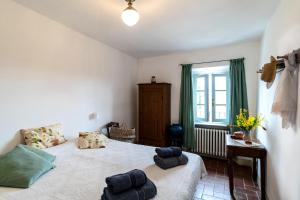 A bed or beds in a room at Locanda Casanuova
