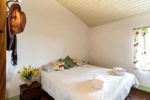 A bed or beds in a room at Locanda Casanuova