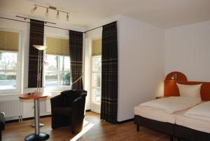En eller flere senge i et værelse på Hotel Waldquelle