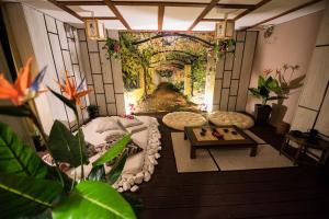 a living room with a view of a garden at Apartament z jacuzzi Kraków in Krakow