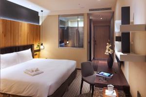 Postel nebo postele na pokoji v ubytování La Vida Hotel