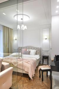 a bedroom with a bed and a glass wall at Rydygiera 16-18 by Homeprime in Warsaw
