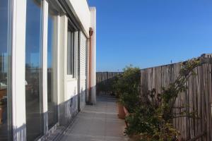 a balcony of a building with a fence at Mini Attico panoramico con terrazza in Cagliari