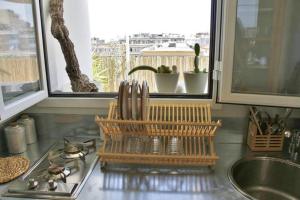 a kitchen counter with a stove and a sink at Mini Attico panoramico con terrazza in Cagliari