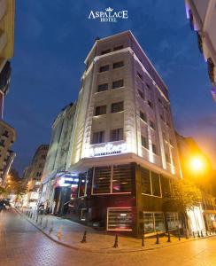 a tall building on a city street at night at Aspalace Hotel The Istanbul Old City in Istanbul