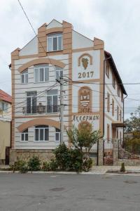 a building with a sign on the side of it at Бутик 2017 in Bilhorod-Dnistrovsʼkyy