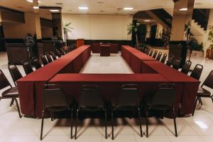 a conference room with a long table and chairs at Hotel Boulevard in Lima
