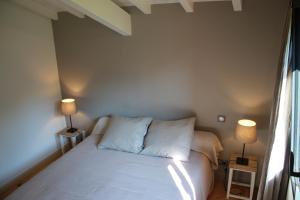 En eller flere senge i et værelse på Narbaitz Vacances