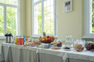 a table with a buffet of food on it at Casa F.A.C.I in Marina di Massa