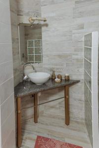 a bathroom with a sink and a mirror at Бутик 2017 in Bilhorod-Dnistrovsʼkyy
