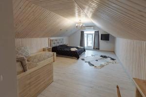 a large room with a bed and a couch at Бутик 2017 in Bilhorod-Dnistrovskyi