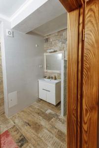 a bathroom with a sink and a mirror at Бутик 2017 in Bilhorod-Dnistrovsʼkyy