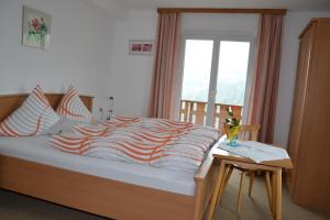 A bed or beds in a room at Pension Armella