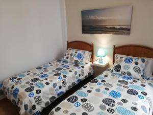 A bed or beds in a room at mirador del roque 2