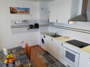 A kitchen or kitchenette at mirador del roque 2