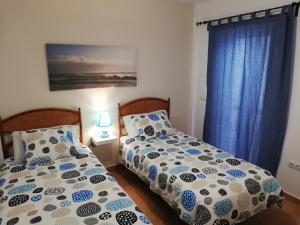 A bed or beds in a room at mirador del roque 2
