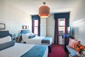 Postel nebo postele na pokoji v ubytování Hotel Triton