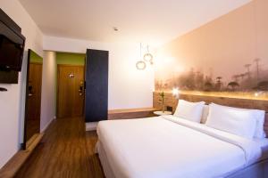 Cama ou camas em um quarto em Hotel Cassino Tower Curitiba Aeroporto By Nacional Inn