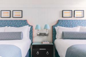Postel nebo postele na pokoji v ubytování Hotel Triton