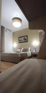 Postel nebo postele na pokoji v ubytování B&B Il Campanile