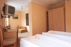 Posteľ alebo postele v izbe v ubytovaní Hotel Zamek