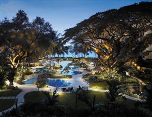 a view of a resort pool at night at Shangri-La Rasa Sayang, Penang in Batu Ferringhi