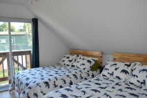 En eller flere senge i et værelse på Les 4 chalets - Le 609