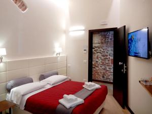 Postel nebo postele na pokoji v ubytování Arena Luxury Suite + 35 fotografií