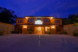 a building with a sign on the front of it at Hotel El Cerro in Liberia