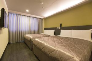 Postel nebo postele na pokoji v ubytování Chance Hotel