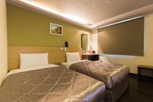 Postel nebo postele na pokoji v ubytování Chance Hotel