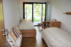 A bed or beds in a room at Apartmán Lipánek