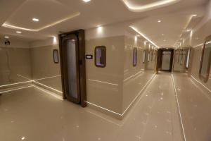 a hallway of a subway train with a hallway at Qubestay Airport Capsule Hotel & Hostel in Mumbai