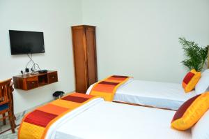 Postel nebo postele na pokoji v ubytování Mojo M Villa -Airport Boutique Hotel