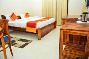 Postel nebo postele na pokoji v ubytování Mojo M Villa -Airport Boutique Hotel