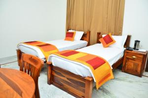Postel nebo postele na pokoji v ubytování Mojo M Villa -Airport Boutique Hotel