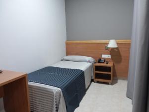 Postel nebo postele na pokoji v ubytování Hotel Inglés
