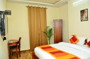Postel nebo postele na pokoji v ubytování Mojo M Villa -Airport Boutique Hotel