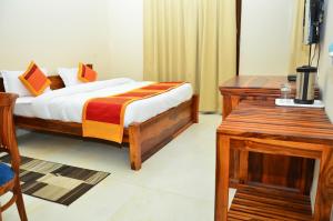 Postel nebo postele na pokoji v ubytování Mojo M Villa -Airport Boutique Hotel
