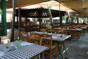 an outdoor restaurant with tables and chairs at Kampi Double Storey House in the Village in Nicosia