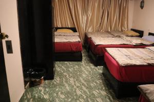 A bed or beds in a room at Wake Up! Cairo Hostel