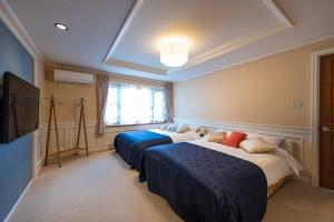Postel nebo postele na pokoji v ubytování Enoca Hotel