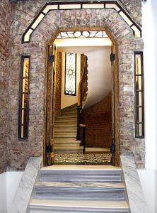 The facade or entrance of Frida Suites
