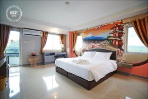 Postel nebo postele na pokoji v ubytování BCP Hotel
