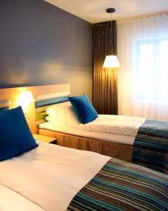Postel nebo postele na pokoji v ubytování Thon Hotel Brønnøysund