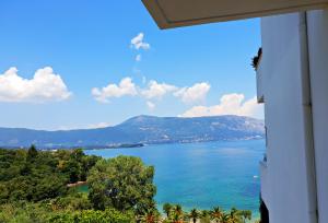 a view of a large body of water from a house at Dimitra Apartments K in Kommeno
