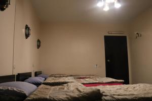 A bed or beds in a room at Wake Up! Cairo Hostel